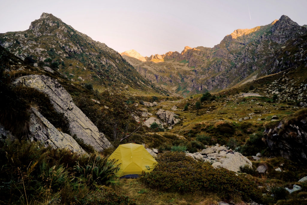 A lightweight tent for two people in a beautiful alpine landscape.