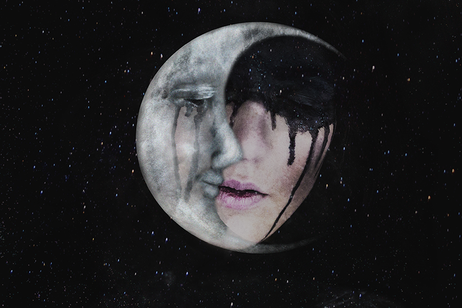 The dark side of creativity displayed by a moon face with black tears.