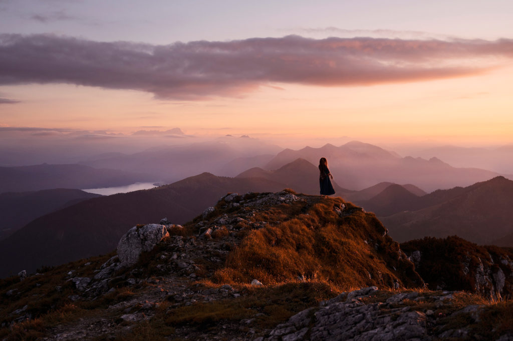 A woman enjoying the present moment in the mountains.