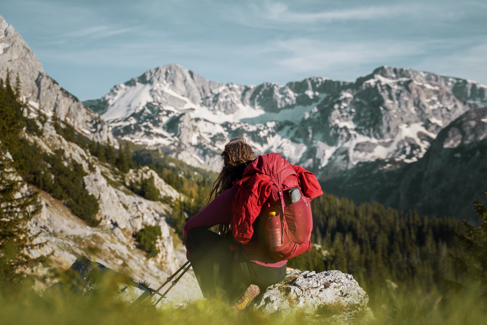 A female solo hiker with a large backpack in the mountains of Bosnia.